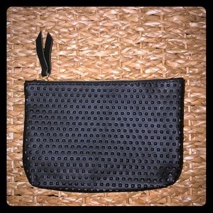 Black IPSY makeup bag with gold zipper